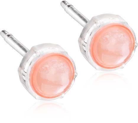 Pinkish-orange lip gloss in clear round containers with applicator sticks.