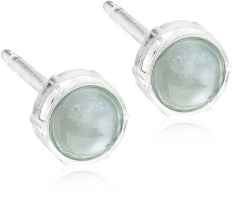 Clear facial patches in round plastic containers with applicator sticks.