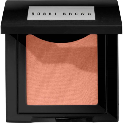 En rosaaktig persikafärgad rouge i en svart förpackning med märket 'BOBBI BROWN' på locket.