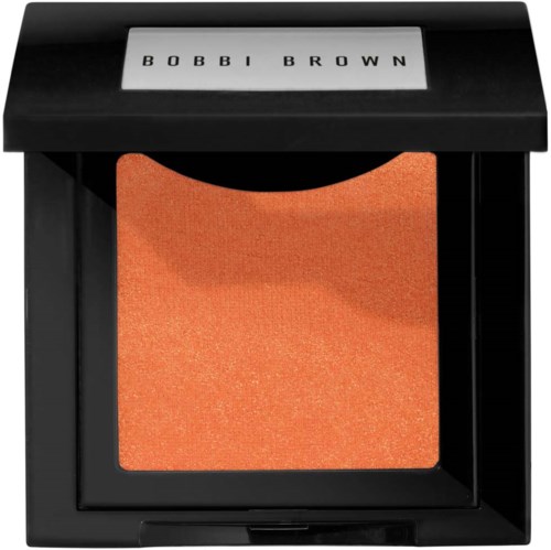 En liten Bobbi Brown sminkprodukt med orange-glittrande puder inuti.