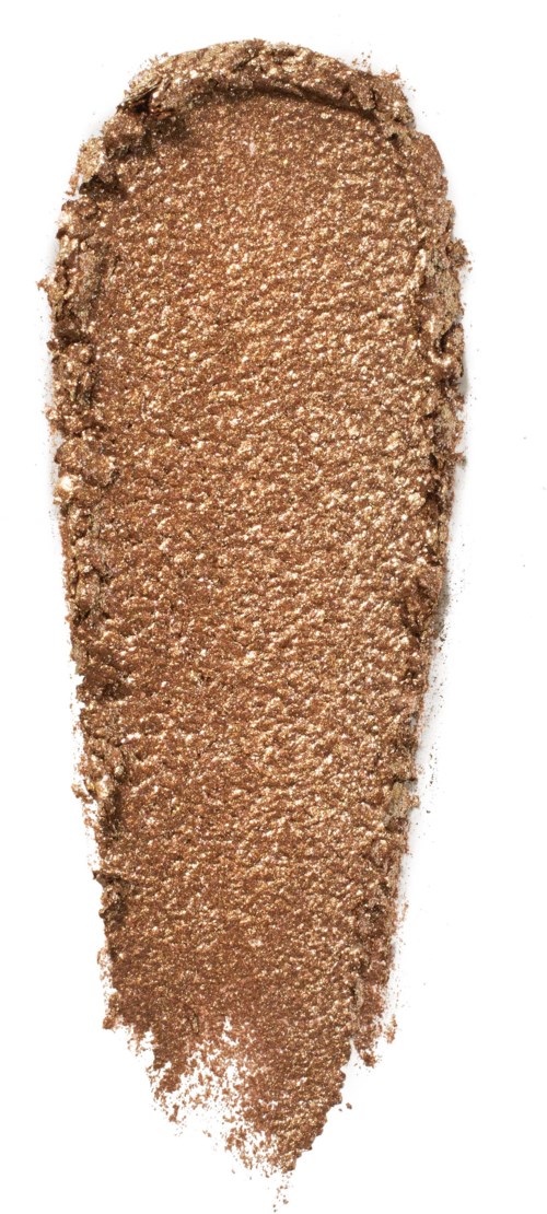 Brown powder spread in a rounded, elongated shape on a white background.