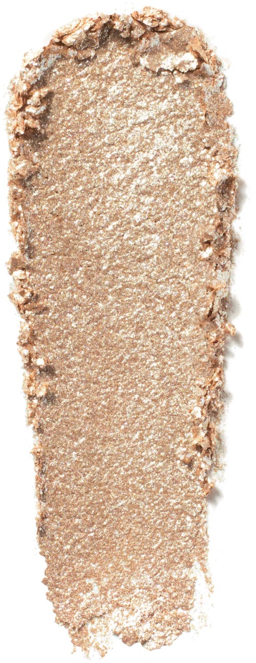 A crushed beige eyeshadow with a rough, dusty surface and uneven edges.