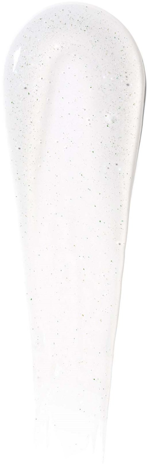 Een witte, vlekkerige vloeistofdruppel, langwerpig. Het ziet glad en glanzend uit.