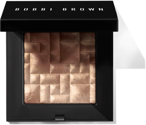 En kvadratisk makeup-pallett med glitrende, pikselaktige bronse- og gullpulver, merket 'BOBBI BROWN'.