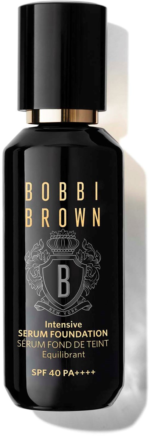 Czarna butelka podkładu Bobbi Brown z złotym i białym tekstem, SPF 40, i błyszczącym czarnym nakrętka.