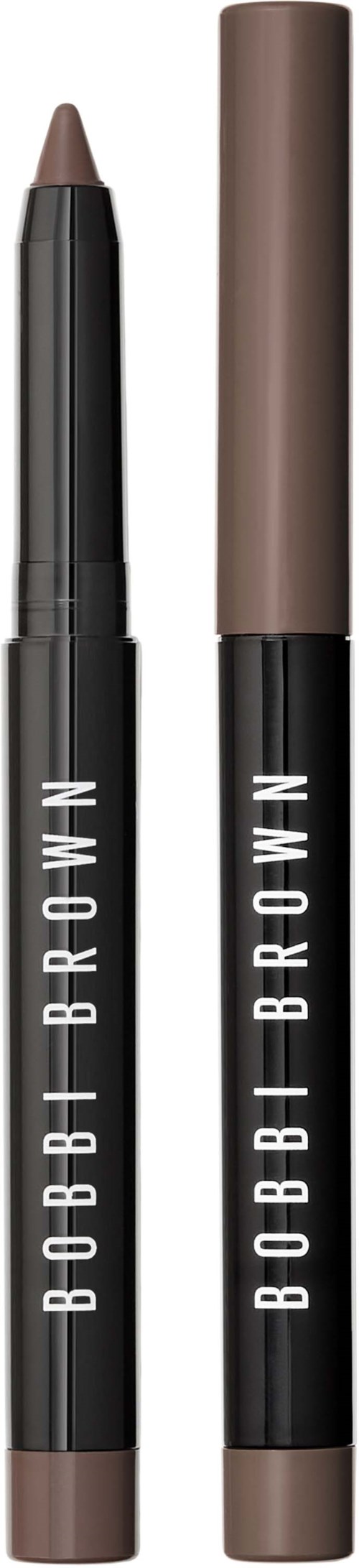 Two Bobbi Brown makeup pencils, one with a powder shade and the other with a darker hue, are shown standing upright.