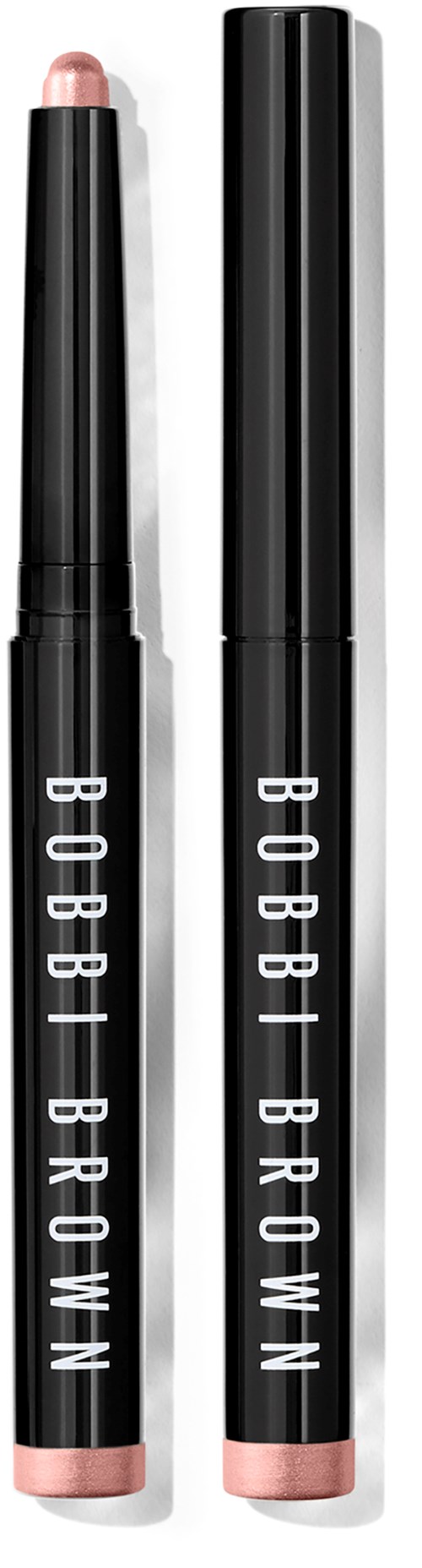 Zwei schwarze Lippenstifte mit rosa Spitzen, mit 'BOBBI BROWN' beschriftet.