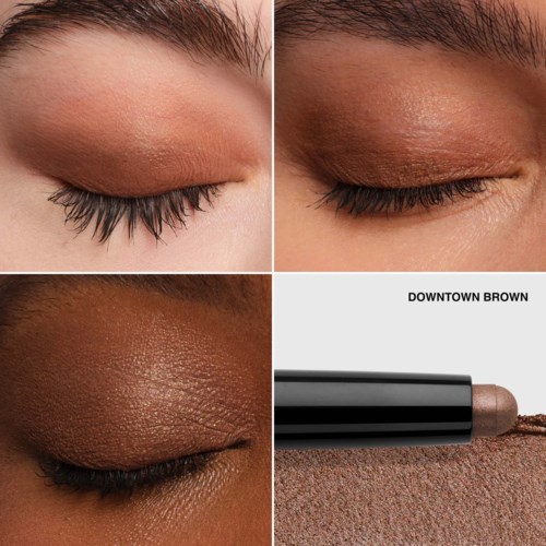 Close-up van drie ogen met verschillende oogschaduwkleuren en een oogschaduwpotlood gemarkeerd "DOWNTOWN BROWN."