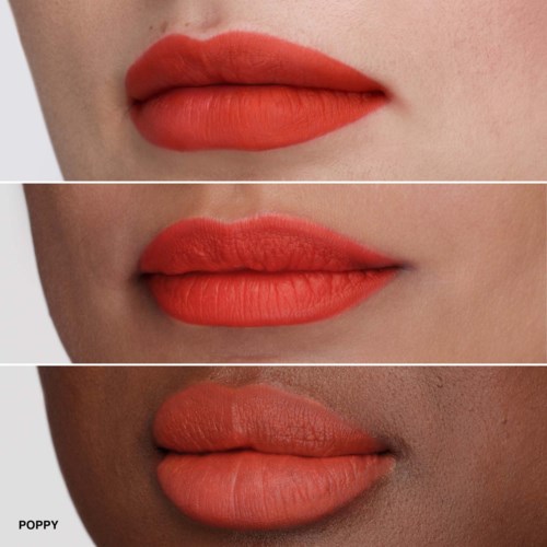 Three lips with different skin tones and shades of orange lipstick.