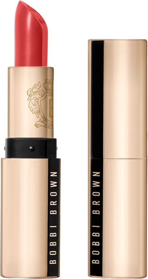 Bobbi Brown lippenstift met goudkleurige en zwarte verpakking, open voor roze-koraal kleur.