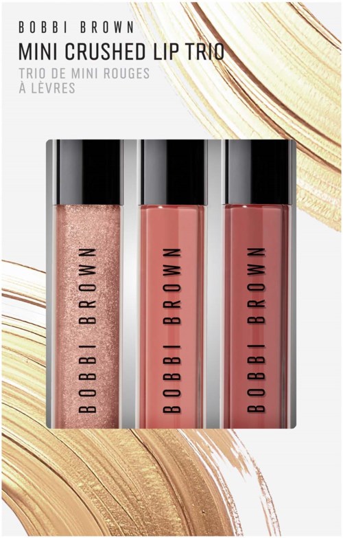 Tre Bobbi Brown læbepomader i forskellige nuancer på hvid baggrund med guld accenter.