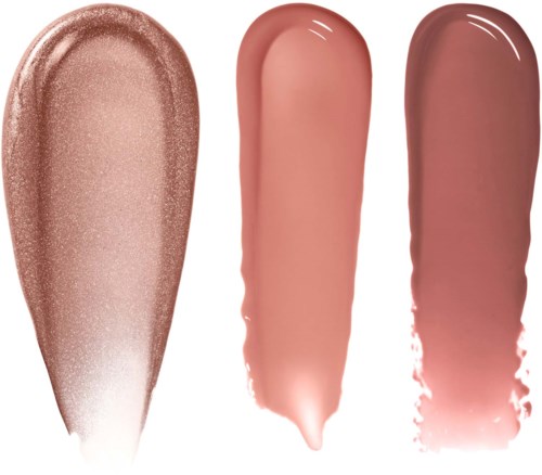 Tre forskellige læbestift- eller lip gloss-prøver i nude- og lyserøde nuancer.