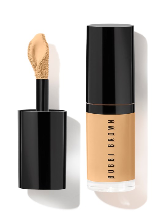 A beige concealer with a black cap, and a separate bottle of foundation labeled 'Bobi Brown' with a black cap.