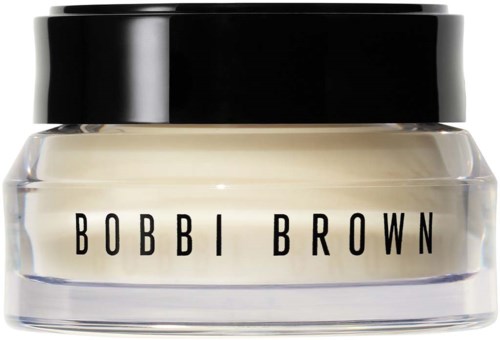 Mały słoik z czarnym wieczkiem i białym kremem, oznaczony BOBBI BROWN.
