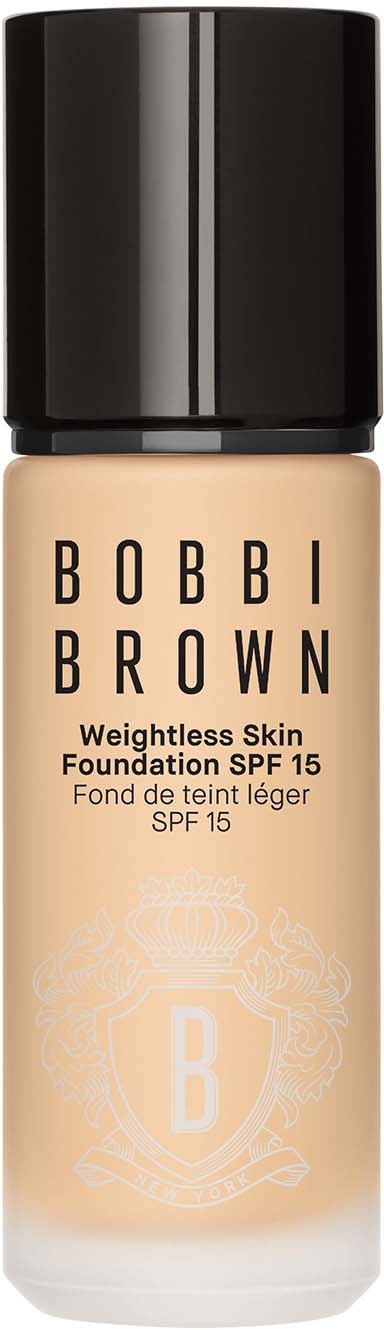 Foundationflaska med svart lock, beige färg och Bobbi Brown-logga, SPF 15, för lättvikts hud.