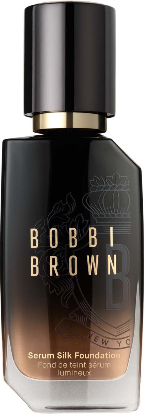 A black and gold bottle of Bobbi Brown serum silk foundation with a black cap.