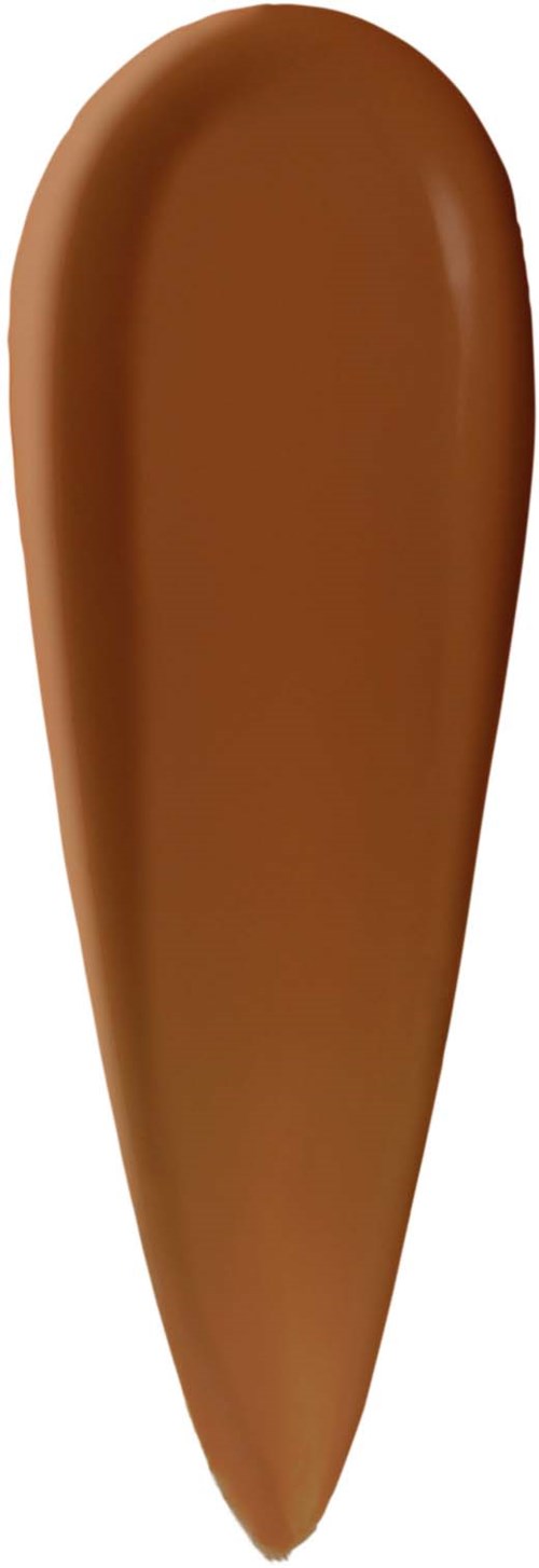 A smear of brown liquid foundation on a white background.