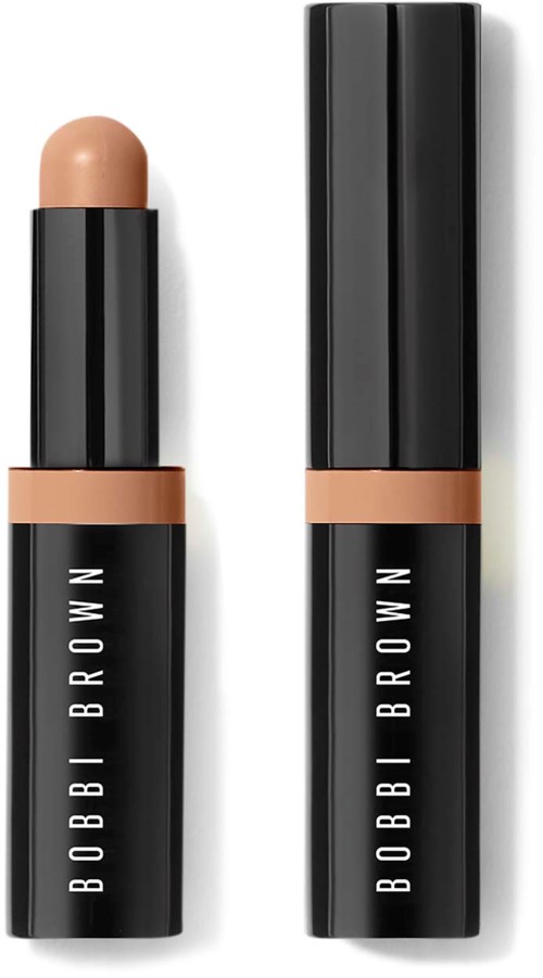 Zwei schwarze Bobbi Brown Make-up-Röhren, eine mit beige Kappe und Lippenstift, die andere geschlossen.