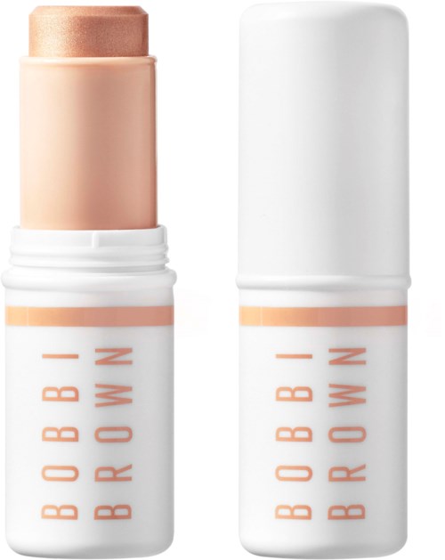 En leppepomade i stift med hvit etui og oransje bokstaver. Låsen er fjernet, og beige leppepomade er synlig.