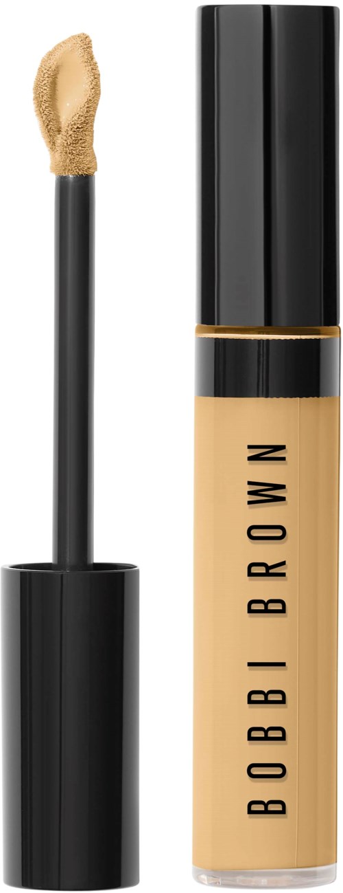 En beige flytande concealer-glasyr med svart lock, öppnad med appliceringsborste.