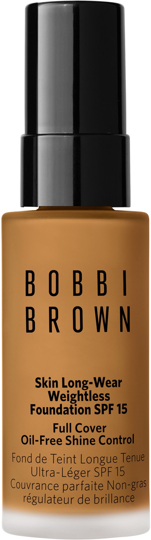 En flaska av Bobbi Brown foundation med svart lock och beige vätska inuti.