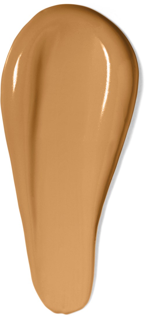 En stor, slät, beige makeupprov med glänsande yta, formad som ett böjt tår.