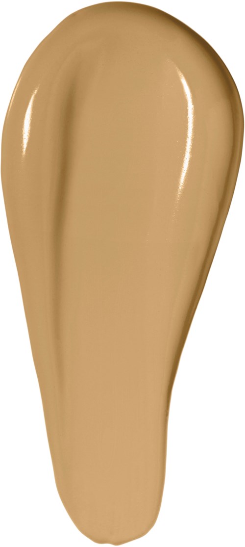 En beigefärgad makeupgrund eller concealer prov med slät, något glansigt textur.