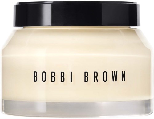 Słoik kosmetyków z czarną pokrywką i białym kremem, oznaczony Bobbi Brown.