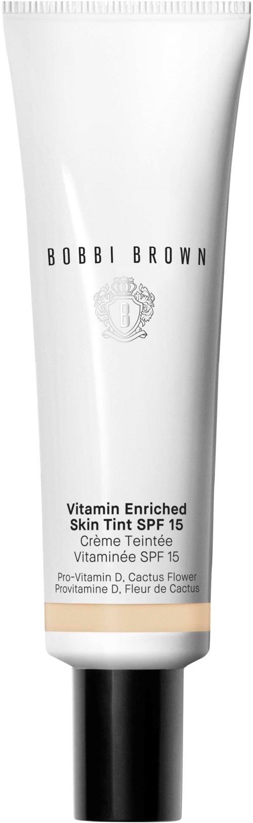 En vit tub med Bobbi Brown Vitamin Enriched Skin Tint SPF 15 med svart lock, minimal text och logo.