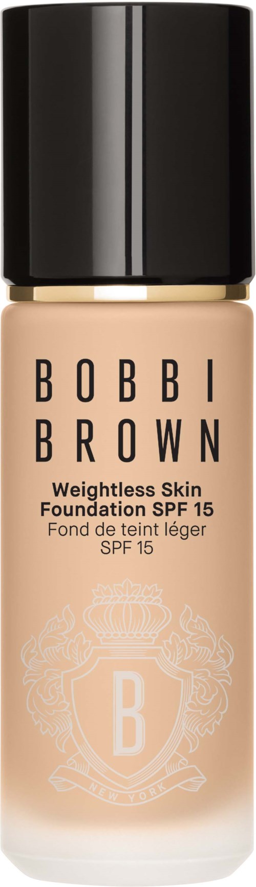 Ett foundationsflaska med svart lock, beige vätska, och Bobbi Brown-logotyp och text.