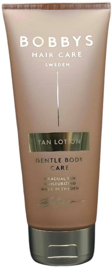 Een beige tube met een zilveren dop, gelabeld 'Bobbys Hair Care, Sweden, Tan Lotion, Gentle Body Care.'