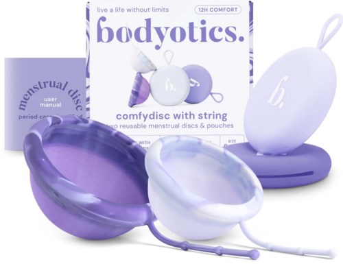 A set of purple and white reusable menstrual discs and pouches, with box showing brand name 'bodyotics' and product details.