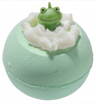 A bath bomb with a small green frog figure emerging from fluffy white clouds on top.