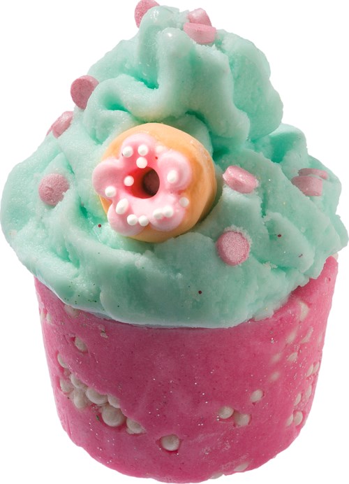 En farverig muffin med pink og grøn glasur, pink krymmel og en doughnutformet pynt på toppen.