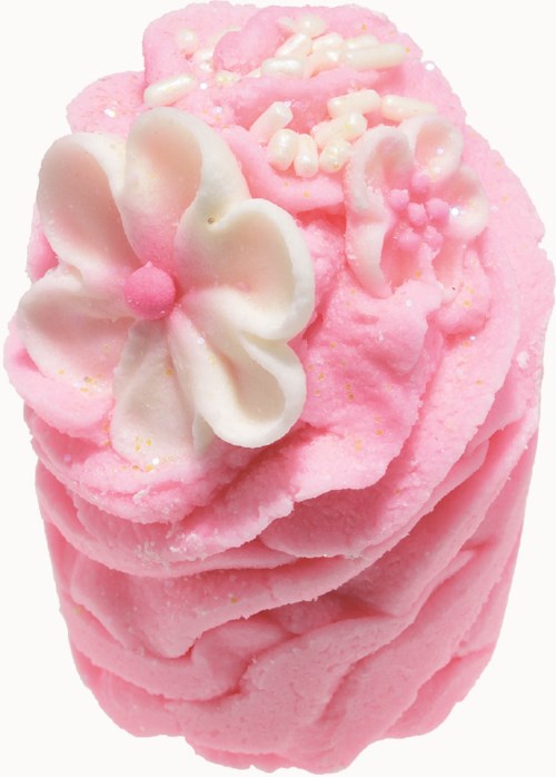 Lyserød sæbe med hvide blomsterdekorationer og små pastelfarvede drys på toppen.