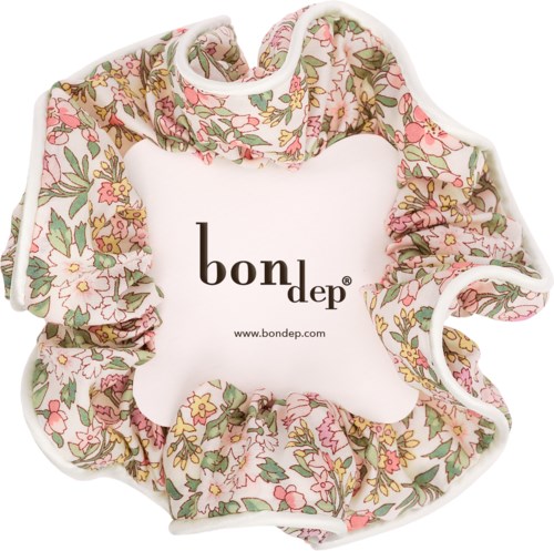 A fabric scrunchie with pink, green, and yellow floral patterns surrounds a Bondep logo on a white background.