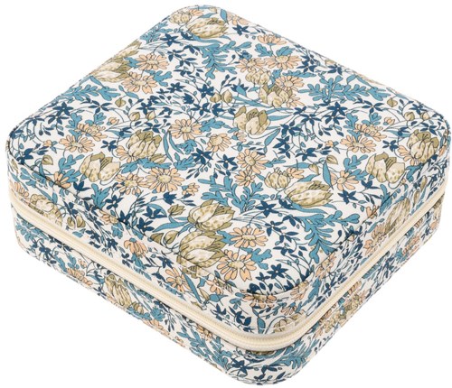 Blommönstrad stängbar kudde med blå, beige och vita färger.