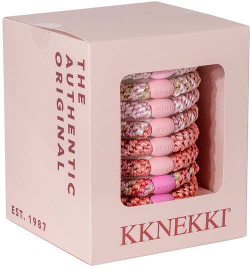A pink box contains colorful, patterned shoelaces with purple plastic tips, labeled as The Synthetic Original by Knekki.