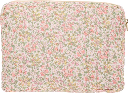 En blomstermönstrad kudde med rosa, gula och gröna blommor på en ljus bakgrund. Rundade kanter och mjukt tyg.