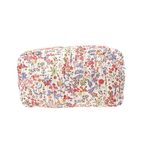 En mjuk tygpåse med färgglad blommönster, används för att förvara kosmetika eller hudvårdsprodukter.