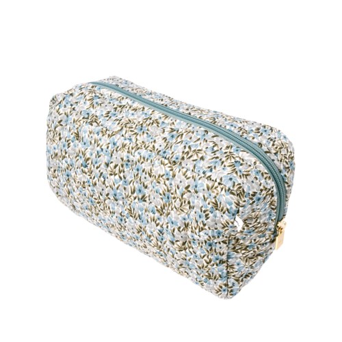 En blommig mönstrad necessär med dragkedja och guldfärgad dragkedja. Den är ovalformad och avsedd för personliga saker.