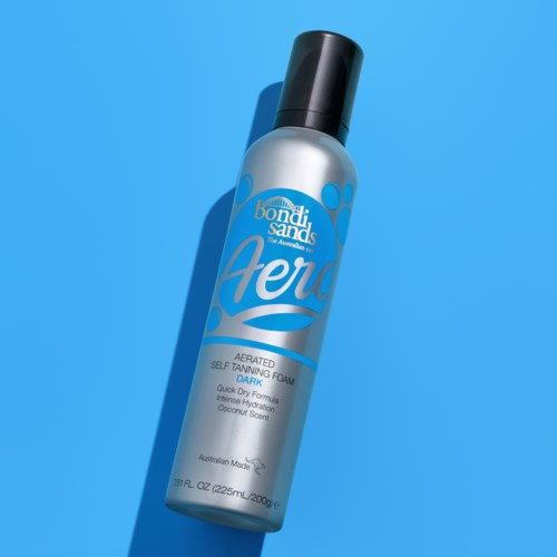 A spray bottle with blue and silver colors, labeled "Aero" and "Bondi Sands," for self-tanning.