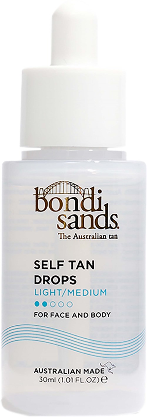 A white bottle of Bondi Sands self tan drops for face and body, labeled as light/medium level, made in Australia.