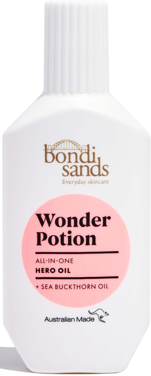 En hvid flaske med rosa mærkat, der siger 'Wonder Potion' og nævner hero olie og havtornsolie.