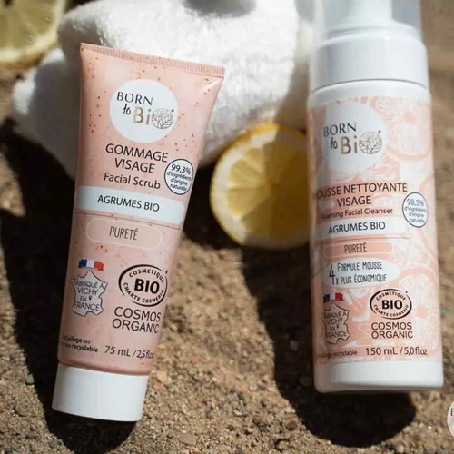 Two skincare products: a facial scrub and a cleansing milk, both organic with French labels, one with lemon and the other with a white bottle design.
