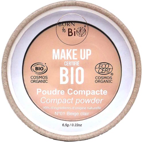 A round jar lid with beige compact powder, labeled as organic and eco-certified, mainly in peach and white colors.