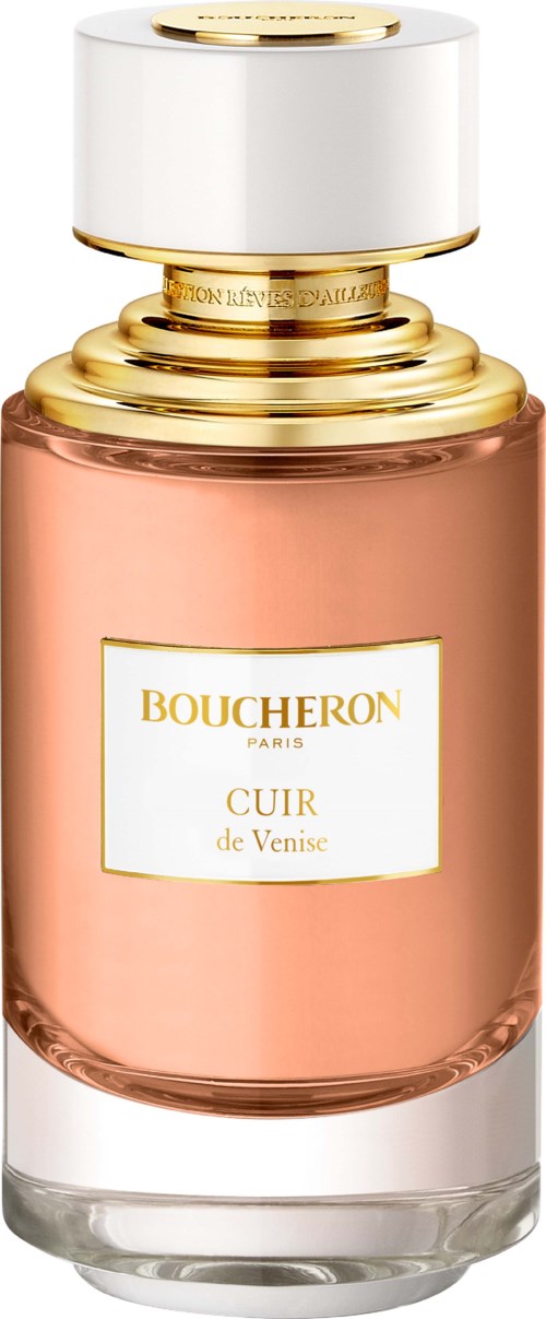 En parfyllåda med vit och guldaktig topp och ljusrosa kropp märkt 'Boucheron Paris Cuir de Venise.'