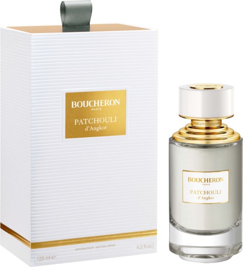 En parfymeflaske og eske med gulldetaljer og Boucheron Patchouli d'Angkor-merke.