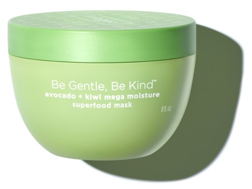 En grön burk för en ansiktsmask med orden "Be Gentle, Be Kind", innehållande avokado och kiwi. Skugga på högra sidan.