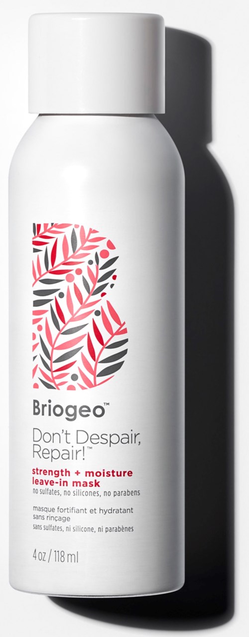 A white bottle with a red and black leaf design, labeled as 'Briogeo' hair care product for repair and moisture.